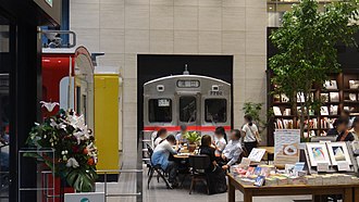 The cab end of former car 7702 preserved inside the Maruzen Ikebukuro bookshop in Tokyo in August 2017 Tokyu 7702 Maruzen Ikebukuro 20170813.jpg