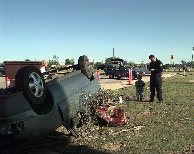 File:Tom Frello and son Zachary look at their brand new van that was destroyed in a tornado, the F-5 tornado devastated a good portion of Oklahoma City, Oklahoma, just barely missing Tinker AFB, Oklahoma DF-SD-00-03257.jpg