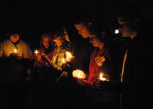US Navy 080606-N-9860Y-006 Participants in the Relay For Life North Whidbey hold candles in honor and remembrance of cancer survivors and victims at the Oak Harbor Middle School.jpg
