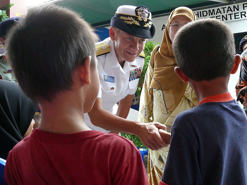 File:US Navy 080709-N-4431B-971 Rear Adm. Nora W. Tyson, commander of Logistics Group Western Pacific, greets children at Sekolah Kebangsaan Kijal Elementary School.jpg