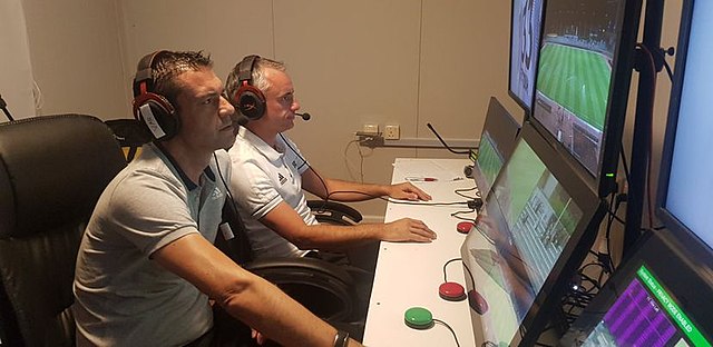 Assistant video assistant referees in action during a Saudi Professional League match