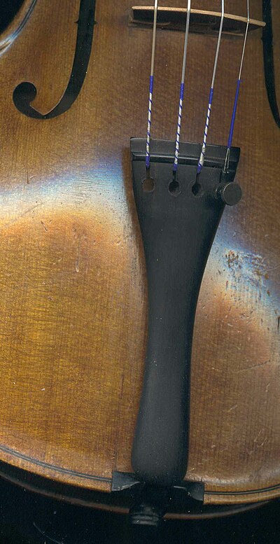 This violin tailpiece has one fine tuner on the E string. Violin tailpiece.jpg