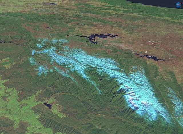 The Monaro Plains (top right) are drier than the verdant western upslopes (bottom left) as they lie in a rain shadow. (View of the Snowy Mountains reg