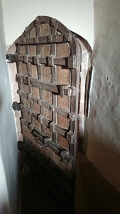 Yett between the tower and the church at St Cuthbert's Church, Great Salkeld, Cumbria, viewed from inside the tower. Yett at St Cuthbert's Church Great Salkeld.jpg