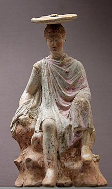 Young boy seated on a rock, ca 300 BC Young boy BM C274.jpg