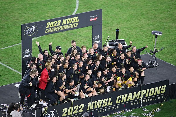 Thorns players and staff celebrate winning the 2022 NWSL Championship at Audi Field.