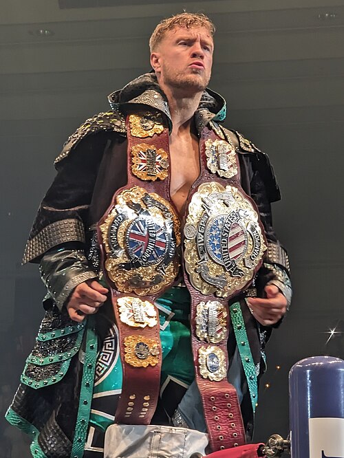 Two-time and final champion Will Ospreay, shown here with the original belt (right) and his custom-made rebranded IWGP United Kingdom Heavyweight Cham