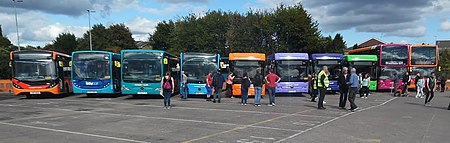 The modern day fleet at Cardiff Bus' Depot Open Day on 24 September 2022 to celebrate 120 years of service A line of modern livered buses at Cardiff Bus' Open day (geograph 7309759).jpg