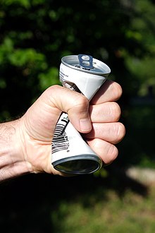 Aluminium-can-squeezed-by-hand.jpg