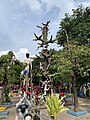 Thorn tree with climbing it as a punishment, at a hell scenery in Wat Muang, Thailand