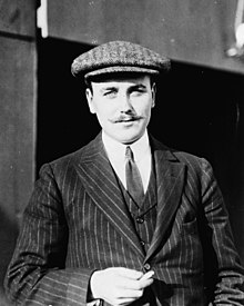 Anthony J. Drexel, Jr., millionaire aviator, half-length portrait, standing, facing forward, wearing cap LCCN91783781 (cropped).jpg