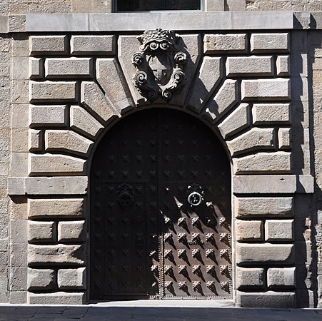 Keystone much enlarged for decorative effect, and carrying a coat of arms, Barcelona