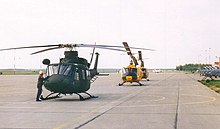 The first CH-146 Griffon arrives at 417 Squadron, CFB Cold Lake. It is parked on the flightline with the CH-118 it is to replace. CH-146 Griffon and CH-118 CFB Cold Lake.jpg