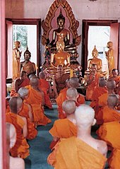 Candidates for the Buddhist monkhood being ordained as monks in Thailand Candidate for the Buddhist priesthood is ordaining to is a monk in a church.jpg
