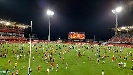 Fans allowed onto the field at Heritage Bank Stadium after a AFL match between the Gold Coast Suns and the Sydney Swans in 2023