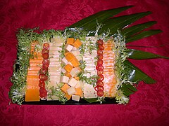 Cheese tray garnished with red pepper rings and chicory.jpg