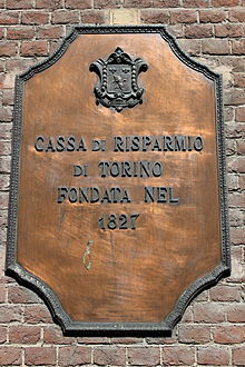 A crest on the wall of a branch in Chieri, in the Province of Turin Chieri - Cassa di risparmio di Torino 1827.JPG