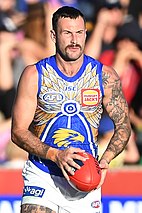 Male athlete in an Australian rules football game