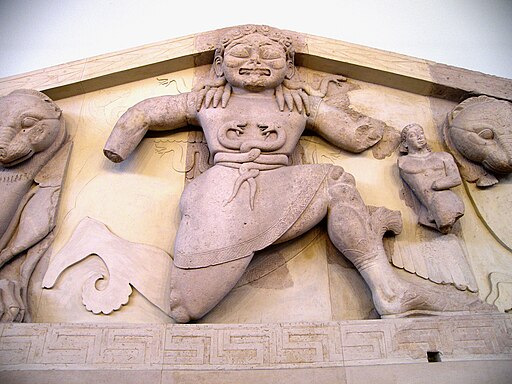 Close up of Gorgon at the pediment of Artemis temple in Corfu