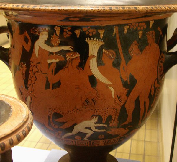 Ploutos with the horn of abundance, in the company of Dionysos (4th century BC)