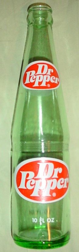 Glass bottle of Dr Pepper featuring the 1970s logo