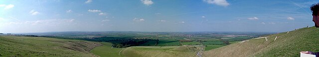 A panoramic view into the Vale; the White Horse is on the right and Dragon Hill centre right