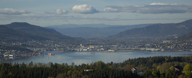 Drammen, The largest city and capital of Buskerud Drammen from east.png