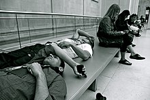 Visitors resting outside of exhibition space at the British Museum Fatigue at the British Museum, 13th July 2011.jpg