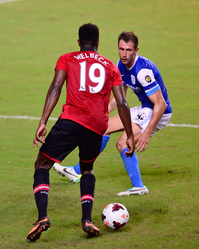 Welbeck (left) playing for Manchester United in 2013 Fernando Recio, player of Kitchee SC, in action against Danny Welbeck.png