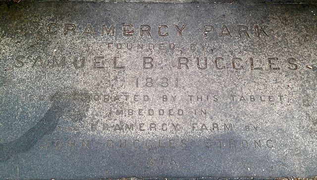 Flagstone near west gate to Gramercy Park bearing the words "Gramercy Park Founded By Samuel B. Ruggles 1831 Commemorated By This Tablet Imbedded in t