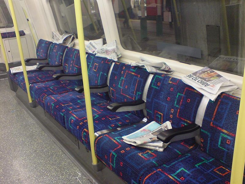 File:Free newspapers on london tube train.jpg