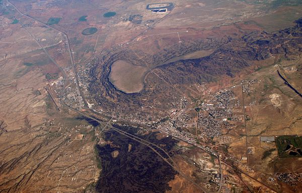 Aerial view of Grants in 2007. Black Mesa is above town, and to the west Grants adjoins Milan. Interstate 40 bends to avoid the mesa.