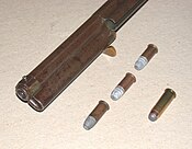 Loading sleeve open, three Henry Flat cartridges, compare with .44 WCF round