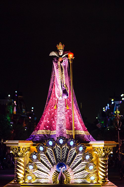 The Evil Queen during Hong Kong Disneyland's Villains Night Out! parade, premiering in 2016, with the peacock motif prominent