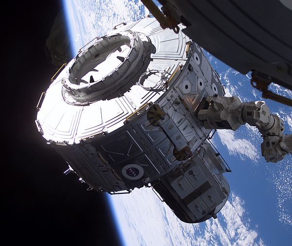 Quest being grappled by Canadarm2, prior to its installation on the ISS