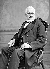 John Taylor seated in chair.jpg