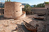 Central courtyard of Khasab Castle with traditional fishing boats on display