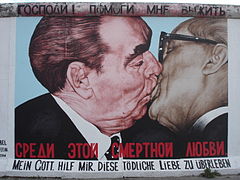 Graffiti of two communist leaders kissing, on the Berlin Wall