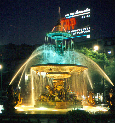Rossio Square, Lisbon, in June 1968, showing a TAP commercial in the background at night