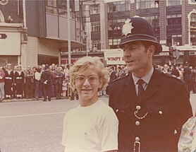 Met Police officer in 1974 wearing a blue shirt which was phased out in the 1980s. London, 1974, a Bobby and a lad.jpg