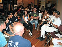 As part of the Manzanar At Dusk program, Wilbur Sato (at far right) relates his experiences in Manzanar during a small group session MAD-Sato07.jpg