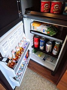 A refrigerated minibar in a Grand Hyatt hotel, filled with beverages. This minibar detects whenever an item is removed, and charges the guest instantly, even if the item is not consumed. Mini-bar.jpg