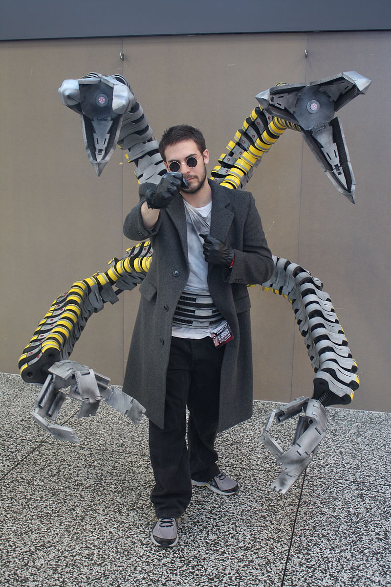 A father and his son cosplay DC character Batman (Left) and Marvel's  Spiderman enemy Doctor Octopus (Right) during the first day of the SOFA  (Salon del Ocio y la Fantasia) 2021, a