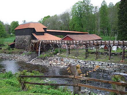 Naes ironworks, restored furnace building with waterwheel Naesverk2.jpg