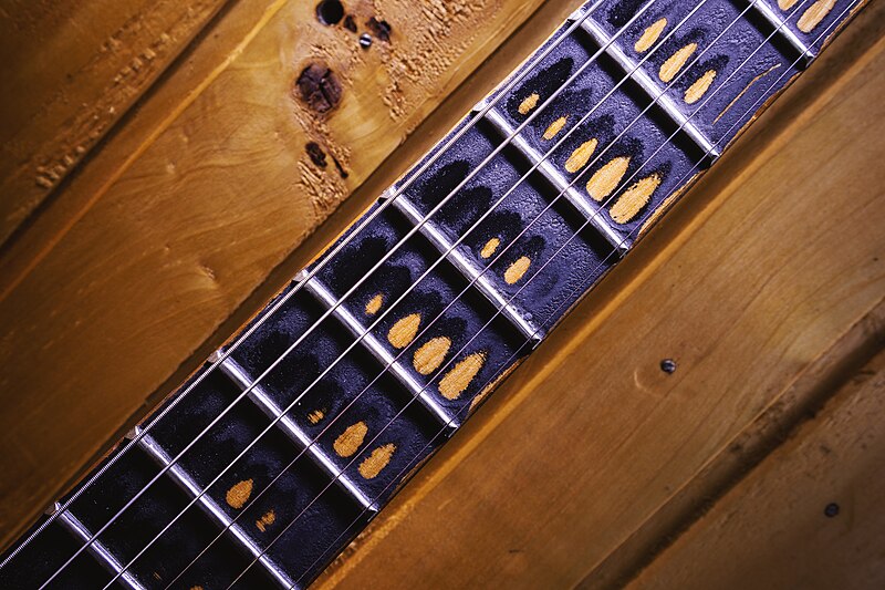 File:Neck and Fretboard of an Old Guitar (51883975223).jpg