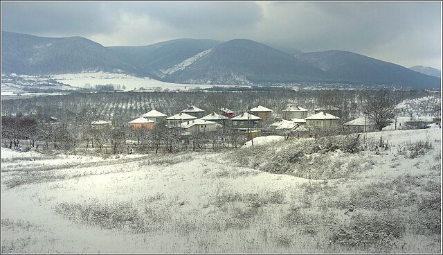 Winter view of Razboyna village with the Preslav Mountains in the background
