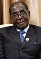 Robert Mugabe was the president of Zimbabwe from 1987 to 2017. He did a lot for the country, also fighting the effects of colonialism. From about 2000, he ruled as a dictator. He was criticized for redistributing land for farming, There was widespread poverty and famines during his rule. There were reports of human rights abuses. Mugabe seems to have earned his fortune trading diamonds. Today, the view of Mugabe is ambivalent.