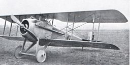 Military biplane parked on airfield