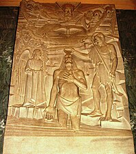 Parrocchiale di San Michele. Il Battesimo di Cristo nel Giordano - Bassorilievo su lastra marmorea dello scultore Franco Pirastu Usai - 1958.