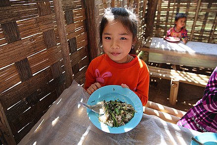 A child eats a WFP school meal in Lao. Photo: WFP/Vilakhone Sipaseuth